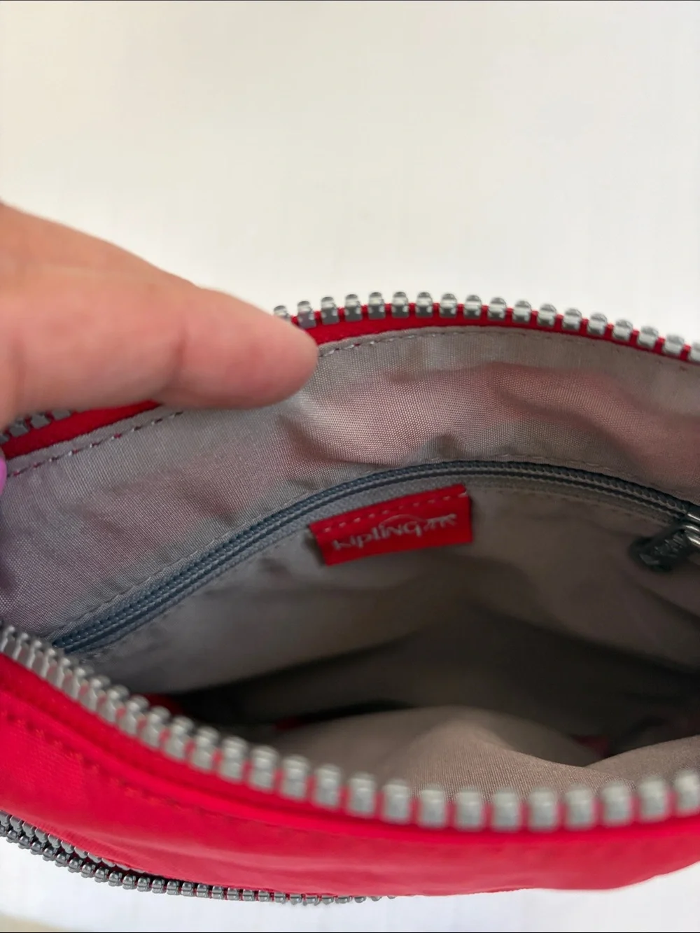 Kipling Red Crossbody with Playful Pom Charm